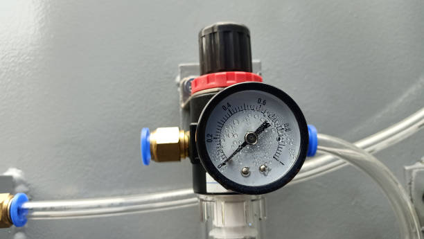 Pressure gauge and regulator on an industrial hot water high pressure washer